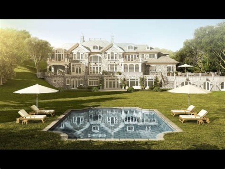 The Up And Down History Of Evander Holyfield's Unbelievable Former Mansion (Current Owner: Rick Ross)